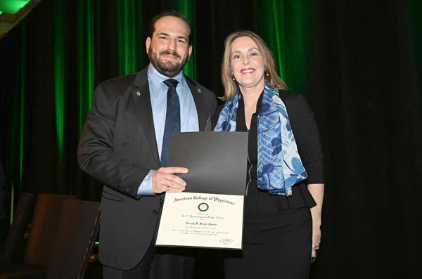 Dr. Jason M. Goldman presents Rep. Kathy Castor (D- FL-14th) with the Joseph F. Boyle Award